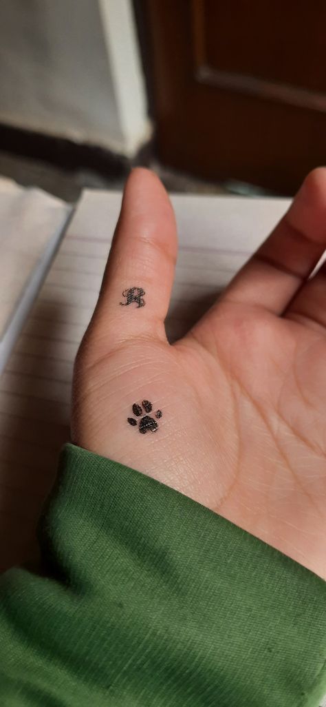 Tattoo design dog foot print and letter R Dog Paw Tattoo With Letter, R Letter, Dog Paw Tattoo, Paw Tattoo, Foot Print, Letter R, Dog Paw, Tattoo Idea, Dog Paws