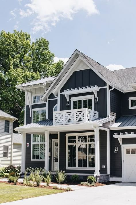 White trim on a dark navy blue home showcases a stunning contrast with farmstyle appeal. Exterior With Red Brick, Navy Blue House Exterior, Blue House White Trim, Navy Blue House, Blue Home Exterior, Transitional Home Exterior, Blue House Exterior, Navy Blue Houses, Dark Blue Houses