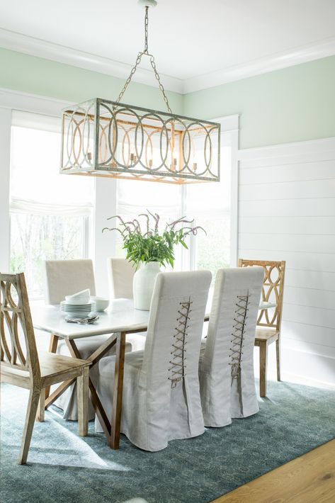 Design a relaxing, tranquil space for dinner parties. The way natural light pours into this dining room makes Benjamin Moore paint color Crystalline AF-485 a soft and bright choice for the walls.   Walls: Crystalline AF-485, Regal® Select, Eggshell // Wainscoting & Trim: Pure White OC-64, Regal® Select, Semi-Gloss // Ceiling: Pure White OC-64, Waterborne Ceiling Paint, Ultra Flat Dining Room Color Ideas, Room Color Ideas, Dining Room Wall Color, Dining Room Colour Schemes, Sage Green Paint Color, Room Colours, Dining Room Paint Colors, Unique Dining Room, Green Dining Room