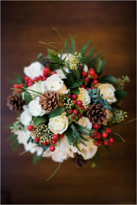 A perfect bouquet for a winter wedding, with white roses, pinecones, red cranberries, and hints of evergreen - beautifully crafted by TWIGS Greenville. Photo by Hannah Woodard // www.hannahwoodardphotography.com Christmas Wedding Flowers, Christmas Wedding Ideas, Red Bouquet Wedding, Winter Wedding Bouquet, Winter Bouquet, Winter Wedding Flowers, Christmas Weddings, December Wedding, Winter Wedding Ideas