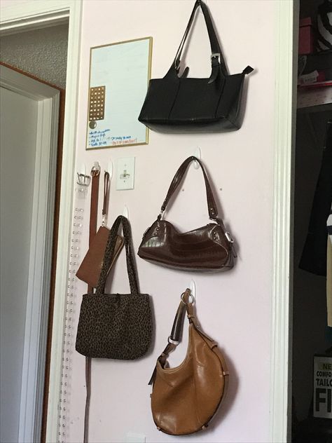 Bag Display Aesthetic, Handbags On The Wall, Purse Wall Aesthetic, Hang Bags In Room, Ways To Hang Purses On Wall, Hanging Handbags On Wall, Purses Hanging On Wall, Purse On Wall, Purse Wall Display Bedroom