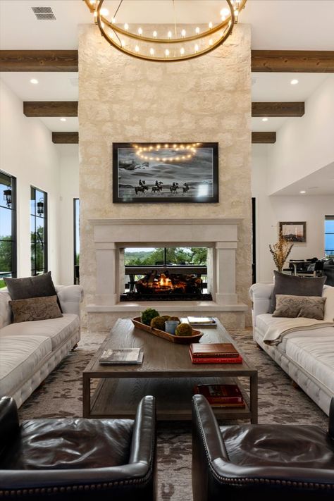 When the view continues seamlessly because of a double-sided #fireplace 😏

#garnerhomes #customhome #fireplacedesign Two Sided Wood Burning Fireplace, Fireplace Dual Side, Two Sided Gas Fireplace, Two Sided Fireplace Living Room, Fireplace Separating Living And Kitchen, Double Sided Stone Fireplace, Double Sided Fireplaces, 2 Way Fireplace Indoor, Center Room Fireplace