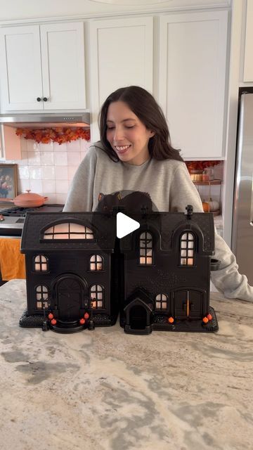 Sheri Wilson on Instagram: "Spooky Haunted House DIY 👻 I couldn’t believe how easy this was and the end result was even better than I expected! I used a thrifted house doll house for this.

-doll house
-black spray paint
-haunted house decor (pumpkins, lamp posts, etc)
-white paper
-hot glue
-orange LED tea light candles

Wipe down the doll house with a cleaning rag, then spray paint the entire thing with black spray paint. Allow it to dry, then add a second coat if needed.

Once dry, attach the decor to the outside of the house with hot glue, add paper cutouts to the inside of the windows, and LED candles inside to light it up.

#halloweendecor #halloweendecorations #halloweendiy #hauntedmansion #spookyseason #halloweenvibes #halloweenmood #halloweencountdown" Doll House Haunted House, Hug Monster, Hocus Pocus House, Sheri Wilson, Haunted Gingerbread House, Haunted House Craft, Countdown To Halloween, Haunted House Diy, Led Tea Light Candles