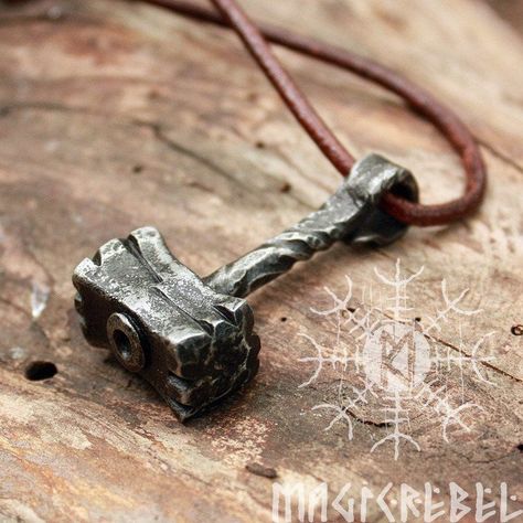 "This is a forged iron handmade Viking style pendant. The pendant is a mini replica of an ancient Nordic hunting hammer tool. Heavy and solid looking. Style is unisex, looks good on both men and women. Hammer length is about 1.75\" inches or 45 mm. Pendant is coated by a water resistant finish to protect from rusting and comes on a thick adjustable brown pressed genuine leather necklace cord. PLEASE NOTE: This is a handmade item and each one looks slightly different. Some details such as the sha Forging Ideas, Thor's Hammer Mjolnir, Viking Metal, Mjolnir Pendant, Hammered Necklace, Iron Jewelry, Thor Hammer, Iron Pendant, Thors Hammer