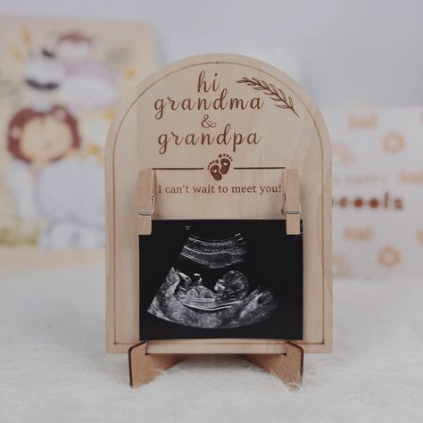 Special Grandparent Announcement: The wood sonogram picture frame serves as a heartwarming and sentimental gift for grandparents to announce the upcoming arrival of a new baby. It provides a unique and personal way to share the joyous news. Premium Material: Crafted from high-quality basswood, the frame ensures durability and a natural aesthetic. The warm tones and grain of the wood add a rustic charm to the sonogram picture, making it a timeless keepsake. Perfect Size: With dimensions of 5.1 inches by 6.6 inches, the frame is compact enough to fit on various surfaces, such as desks, shelves, or bedside tables. Ultrasound Photo 3x4 inches. Home Decor Accent: Beyond its significance as a grandparent announcement, the wood sonogram picture frame seamlessly integrates into home decor. Its ele Baby Announcing Ideas To Grandparents, First Time Grandparents Announcement, Telling Parents They Are Grandparents, Baby Announcement For Grandparents, Pregnancy Announcement For Grandparents, Godparent Request Ideas, Pregnancy Announcement To Grandparents, Family Pregnancy Announcement, Godparent Request