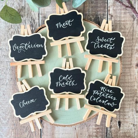 Lots of mini chalkboards making their way to new homes today! Looks like wedding and party buffet season is coming. #luciepritcharddesign #minichalkboards #partytime #wedding #weddingseason #ontheday #foodsigns #cakesigns #handwritten #moderncalligraphy #smallbusinesssupport #shopsmall #preston #lancs #lancashire Table Setting Wedding, Chalkboard Easel, Setting Table, Mini Chalkboards, Wedding Table Names, Table Place Settings, Food Signs, Personalised Cake, Display Signs