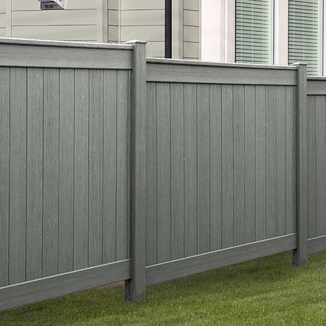 I love the grey color of this PVC fence. The color and design make it look very contemporary. My husband and I are considering getting a fence like this to give us privacy in our home and to give our backyard a more modern look. Grey Backyard Fence, Gray Fence Backyard, Grey Privacy Fence, Grey Wood Fence, Gray Fence Ideas, Backyard Fence Paint Color Ideas, Fence Colors Painted, Fence On Concrete, Pvc Privacy Fence