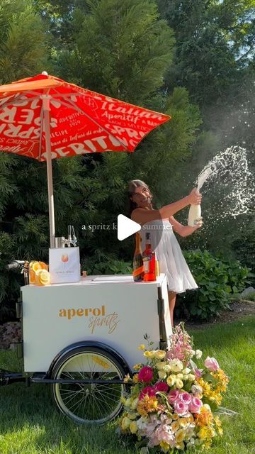 Event & Wedding Caterer on Instagram: "Feeling super bubbly when we have our spritz cart out for an amazing summer full of events🫧🍾 • Spritz Cart: @dolceandgelatocatering  Aperol: @aperolspritzofficial @aperolusa  Prosecco: @mionettoproseccousa  Model: @samanthapotaa  • #wedluxe #longisland #luxewedding  #luxuryweddings #weddingplanning #weareengaged #nybride #bridalinspiration  #nyweddings #libride #hamptons #hamptonsstyle" Aperol Spritz Cart, Unique Event Ideas, Wedding Caterer, Bar Inspiration, Luxe Wedding, Hamptons Style, Event Inspiration, Aperol Spritz, Wedding Catering