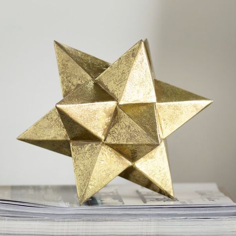 Make your décor the star of the show with this Brilliant Metallic Star Figurine. Crafted of metal with a shiny gold finish, this eye-catching figurine works perfectly as a modern accent or bookend. Metal Table Decor, Ceramic Pineapple, Minimalist Modern Art, Giant Star, Star Decor, Balloon Dog, Star Decorations, Abstract Sculpture, Metal Sculpture