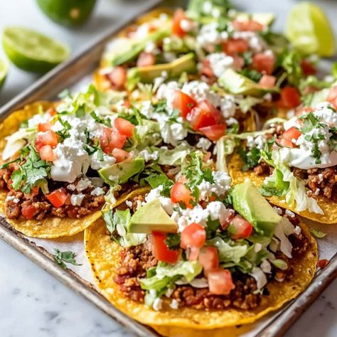 Tostadas - Insanely Good Tostadas Recipes, Ground Beef Refried Beans, Mexican Tostadas, Corn Tostadas, Tostada Recipes, Tomato Cheese, Mexican Crema, Green Salsa, Cotija Cheese