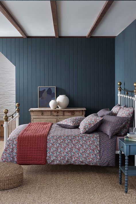 A blue bedroom with iron bed frame and Liberty print floral bedding Dress A Bed, Dreamy Space, Elevated Bed, How To Dress A Bed, Sleeping Positions, Bed Linen Sets, Interior Stylist, Make Your Bed, City House