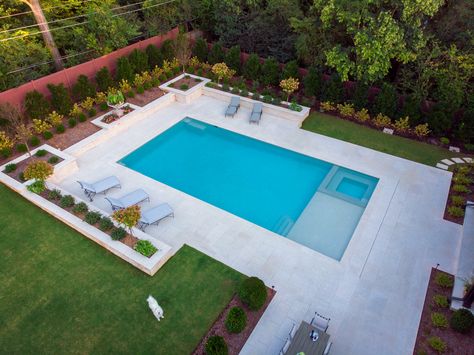 Geometric pool featuring a flushed spa and tanning ledge. #geometricpool Medium Pools Backyard, Pool With Flush Spa, Rectangle Pool Designs With Tanning Ledge, Pool With Tanning Ledge And Spa, Rectangle Pool With Spa And Sun Shelf, Rectangle Pool With Tanning Ledge, Modern Rectangle Pool, Rectangular Pool With Spa And Tanning Ledge, Small Rectangle Pool With Tanning Ledge