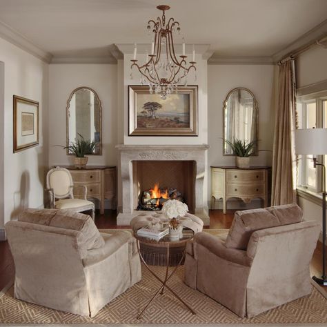 A sense of symmetry brings out the natural beauty in the sitting room. On either side of the fireplace, distressed demilune consoles and stylized mirrors have an old but new quality. The ceiling is a few shades darker than the walls, which adds a coziness to the elegant space. Piano Space, Bathroom Country, Fireplace Sitting Area, Accountable Talk, Fireplace Seating, Cream Room, Country Family, Bedroom With Sitting Area, Ideas Hogar