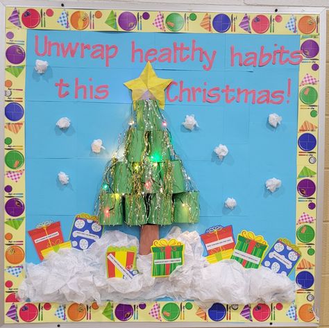 Each gift had a healthy habit on it. Lunch Bulletin Board, Room Bulletin Board, Cafeteria Decor, School Nurse Office Decorations, School Nurse Office, Christmas Bulletin Board, Christmas Bulletin, Nurse Office, Lunch Lady