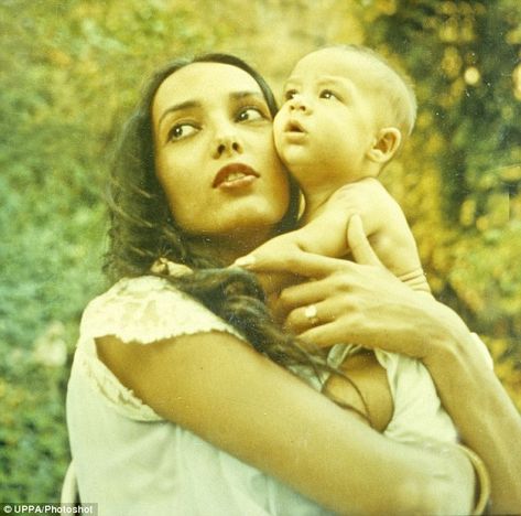 Tender moment: Anna, who passed away in Washington state, is seen cradling her son, Christian, as a baby                                                                                                                                                                                 More Anna Kashfi, The Most Beautiful Woman, Paramount Studios, Family Ties, Holding Baby, Marlon Brando, Film Awards, Film Director, The Godfather