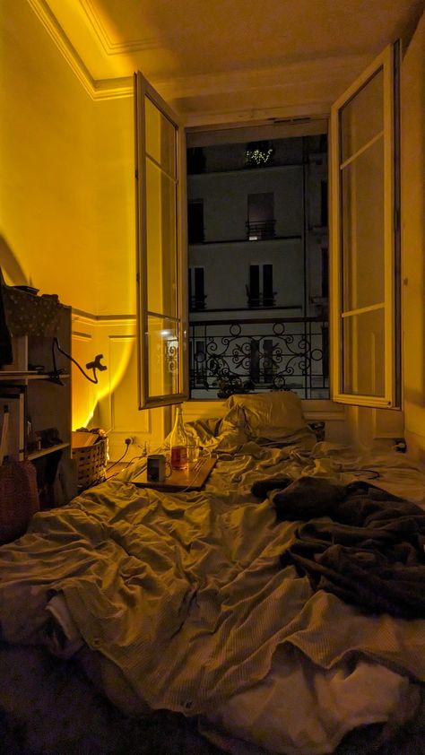 Night in Paris, aesthetic, bedroom, bed , yellow light, sunset light Appartment Aesthetics Night, Paris Apartment Aesthetic Night, Chill Aesthetic Vibes Night Bedroom, Dark Room Aesthetic Bedroom Night, Window At Night Aesthetic, Jazz Bedroom Aesthetic, London Flat Aesthetic, Paris Bedroom Aesthetic, Dark Room Aesthetic Bedroom