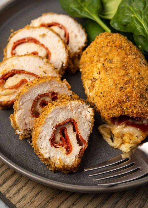 This Pepperoni and Cheese Stuffed Chicken recipe is going to be a new family favorite! Juicy chicken breasts are stuffed with your favorite pizza toppings and coated in a crunchy breading for a delicious meal. Pepperoni Stuffed Chicken, Keto Chicken Dishes, Main Dishes Crockpot, Chicken Rollatini, Pepperoni And Cheese, Grilled Chicken Caesar Salad, Pot Pie Recipes, Chicken With Italian Seasoning, Healthy Meal Recipes