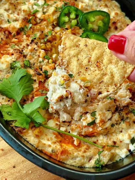 Best Mexican Street Corn Dip  - creamy, spicy cheesy - packed with charred sweet corn, green chiles, fresh cilantro and a squeeze of lime juice. Add tortilla chips for the BEST party appetizer! #mexicanstreet #mexicanstreetcorndip #mexicancorndip #mexicanrecipes #cincodemayorecipe #mexicandips #agoudalife Corn Appetizers, Spicy Corn Dip, Mexican Corn Dip, Street Corn Dip, Mexican Street Corn Dip, Corn Tamales, Mexican Dips, Best Party Appetizers, Cheesy Corn