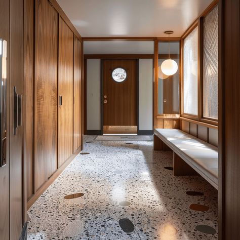 A mid-century modern hallway with classic terrazzo flooring, featuring a unique, speckled appearance that adds visual interest and durability3 Mid Century Modern Foyer, Modern Hallway Decor, Mid Century Modern Hallway, Mid Century Hallway, Modern Hallway Design, Modern Entryway Decor, 70s House, Mudroom Entryway, Modern Entrance