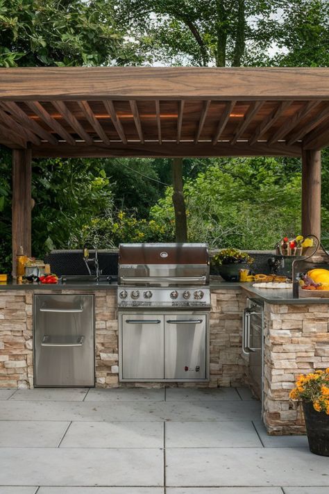 Rustic outdoor BBQ kitchen with a stainless steel grill, stone countertops, and a wooden pergola, set in a lush green garden. Cheap Outdoor Kitchen Ideas, Kitchen Ideas Wood, Wood Outdoor Kitchen, Grill Deck, Bbq Patio, Kitchen Ideas On A Budget, Outdoor Kitchen Plans, Outdoor Bbq Kitchen, Business Place