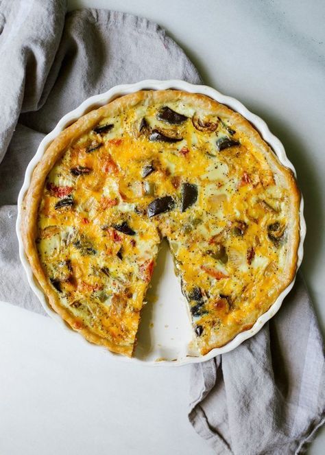 Roasted Summer Vegetable Quiche by Wood and Spoon blog. This is an all-butter pie crust filled with a cheesy quiche! Milk, parmesan, and cheddar are the dairy and fresh cooked vegetables and herbs are the filling. What to do with leftover vegetables and meat? Chop it and bake into this wonderful quiche! Sausage, chicken, bacon, or other vegetables would be a welcome addition for this dish that is great for breakfast, brunch, lunch or dinner. Find the recipe and how to on thewoodandspoon.com by K Cheesy Quiche, Quiche Sausage, Vegetable Quiche Recipes, Roasted Summer Vegetables, Leftover Vegetables, Veggie Quiche, Meat Pie Recipe, Vegetable Quiche, Summer Veggies