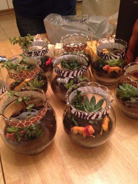 Safari terrariums Jungle In A Jar, Jungle Safari Table Decorations, Animal Kingdom Theme Party, Lion King Center Piece Ideas, Safari Birthday Party Table Set Up, Animal Kingdom Decorations, Wild One Birthday Center Piece, Jungle Birthday Centerpieces, Jungle Party Table Decor