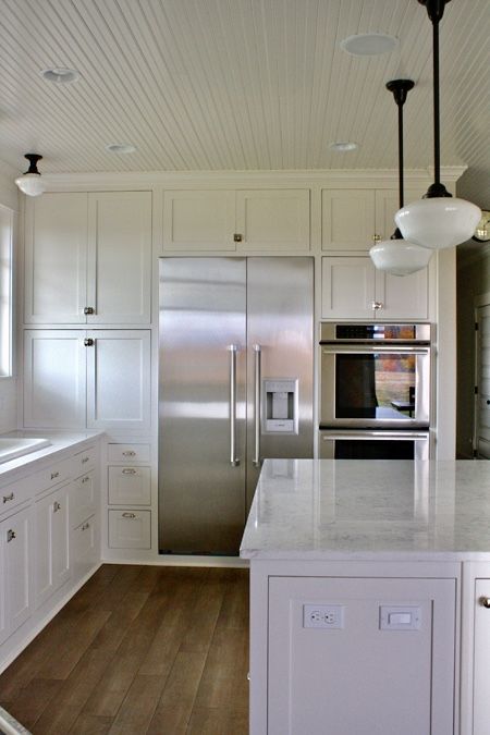 My Farmhouse Kitchen - Part 1 - The Farm Chicks Wall Of Cabinets With Refrigerator, Oven Fridge Side By Side, Fridge And Wall Oven Side By Side, Breadboard Ceilings, Oven Next To Refrigerator, Fridge Wall In Kitchen, Wainscoting Ceiling, Wall Of Cabinets, Schoolhouse Lights