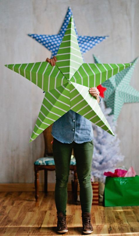 giant paper stars Big Paper Stars Diy, School Christmas Concert Decorations, Large Paper Christmas Decorations, How To Make Big Paper Stars, Poster Board Crafts, Big Christmas Decorations Diy, Large Paper Stars Diy, Cardboard Stars Diy, Large Christmas Decorations Diy