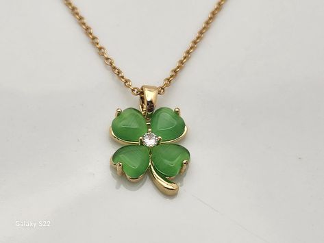 Four Leaf Clover Choker Necklace in Gold Stainless Steel, Green Clover, lucky, 16 inch, adjustable, wishful, trendy, Clovers, charmed,  This is not just a pretty necklace, it's a lucky one! Four leaf clovers are said to be lucky, so wear one around your neck and see what happens!   The chain is stainless steel in gold coloring.  It is 16 inches long, with a 2 inch extender on it.   The clover is set in a beautiful shiny gold with 4 green jewels and a clear rhinestone set in the center. Buy it fo Green Clover Necklace, Green Clover, Pretty Necklace, Clover Charm, Clover Green, Clover Necklace, Pretty Necklaces, Four Leaf, Leaf Clover