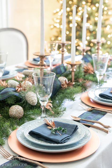 An Easy Christmas Centerpiece for a Long Table - Sanctuary Home Decor | Fresh pine branches, tartan plaid ribbon, and copper greenery mixed with frosted ornaments and tall taper candles make a beautiful and easy Christmas centerpiece for a long table. Navy Christmas Dining Table, Blue Christmas Dinner Table, Navy Christmas Table, Green And Blue Plaid Christmas Table, Table Centerpiece Christmas Tree Blue, Frosted Ornaments, Christmas Color Schemes, Decor Natal, Christmas Feels