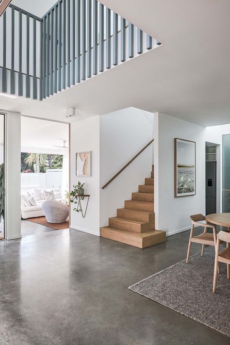 Lavana House – The Designory Open Plan With Stairs In Middle, U Shape Staircase Ideas, Stairs With Turn At End, Bright White House Interior, Stairs Wider At Base, Lounge With Stairs In Living Rooms, Narrow Staircase Design, Partially Open Staircase, Open Plan Stairs In Living Room