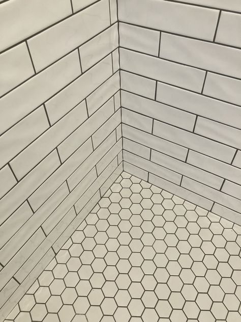 White Hex Shower Floor, White Hexagon Tile Bathroom Floor Shower Subway On Walls, White Hexagon Black Grout, White Hexagon Tile With Black Grout, White Hexagon Tile Bathroom Black Grout, Retro Shower Tile, White Subway Tile Shower Black Grout, Black Grout Shower Tile, White Hexagon Tile Black Grout