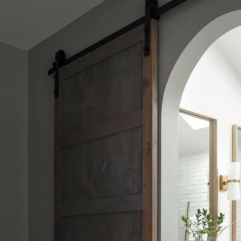 Barn Door Over Arched Doorway, Arched Barn Door, White Oak Cabinets, Arched Doorway, Arch Doorway, Quartzite Countertops, Arched Doors, Oak Cabinets, Sliding Barn Door