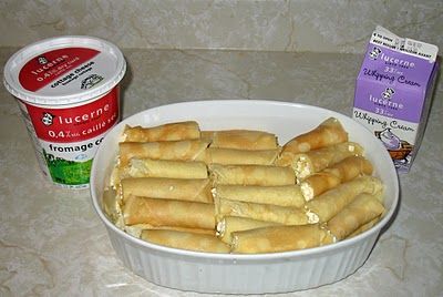 Nalysnyky , or in our family, "Mutty's Cheese Crepes".  These are cottage cheese crepes covered in heavy cream and baked in the oven.  We fight over these every holiday meal. Slavic Recipes, Ukraine Food, Ukrainian Dishes, Dry Cottage Cheese, Cheese Crepes, Ukrainian Food, Russian Desserts, Fast Meals, Cheese Rolls