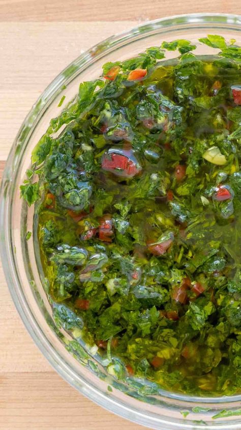 If you love grilled meats, you'll love my easy chimichurri sauce! This easy-to-make Argentinian sauce is packed with flavor that has been described as bright, pungent, spicy, and tangy. Just to give you an idea of how amazingly delicious this sauce is. How To Make Chimichurri, Italian Salsa, Cilantro Chimichurri, Chimichurri Steak, Steak With Chimichurri Sauce, Chimichurri Sauce Recipe, Bread Dipping Oil, Simple Dishes, Steamed Veggies