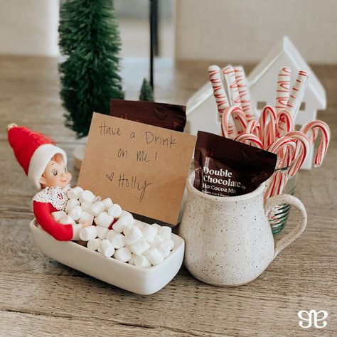 Hot Chocolate Bath — Place the elf in a mug full of mini marshmallows and setup a small hot chocolate bar for the kids to enjoy! It'll be a great way for them to feel involved and to make a special evening for the family. BONUS: Put on a holiday movie while you enjoy your hot cocoa! #elf #elfontheshelf #easy #holidays #creative #hotchocolate #marshmallows #kidfriendly #magic #christmas #chocolate #special #movies #cute #enjoy #elves #movie Elf Drinking Coffee, Elf Hot Chocolate Bar, Elf Hot Cocoa Bar, Elf On The Shelf Hot Cocoa Bar, Elf On The Shelf And Marshmallows, Elf On The Shelf Hot Coco, Elf On The Shelf Ideas Hot Cocoa Bomb, Elf Hot Chocolate On The Shelf, Elf And Marshmallows