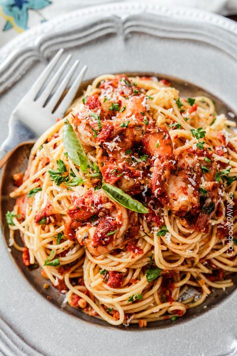 20 MINUTE or less Sun-Dried Tomato Basil Shrimp Pasta packed with juicy shrimp (or chicken) and more flavor than a 5 star restaurant for a fraction of the cost! Tomato Basil Shrimp Pasta, Basil Shrimp Pasta, Tomato Basil Shrimp, Basil Shrimp, Pasta With Shrimp, Pesto Shrimp, Spring Pasta, Pasta Al Pesto, Tomato Basil Pasta