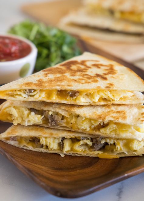 Rise and shine with this easy breakfast quesadilla recipe! Made with eggs, savory sausage, and melty cheese folded between warm tortillas. Easy Breakfast Quesadilla, Avocado Scrambled Eggs, Breakfast Quesadilla Recipes, Cheesy Breakfast, Homemade Salsa Verde, Breakfast Quesadilla, Egg And Cheese Sandwich, Quesadilla Recipe, Breakfast Meat