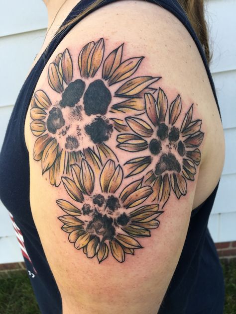 Paw print flower tattoo Paw Print In Flower Tattoo, Dog Paw Sunflower Tattoo, Paw Print Tattoo Sleeve, Lily And Paw Print Tattoo, Pawprint Flower Tattoo, Dog Tattoo Sleeve Ideas, Dog Pawprint Tattoo With Flowers, Paw Prints With Flowers Tattoo, Sunflower With Paw Print Tattoo