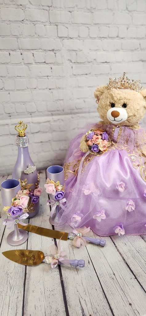 Packages: Complete package includes: 🧸 Quinceanera Bear or Doll (Includes bear or doll, Dress, Petticoat, Jewelry, Metal Tiara, Bouquet, Doll stand, Personalized ribbon) 👸🏻 Tiara upgrade for Bear/Doll  🧸 Doll stand for the Bear/Doll  ️ Kneeling Pillow  👸 Tiara Pillow 📖 Guest Book 🖋️ Pen 📕Bible 🕯️Candle 📷Photo Album 💵Card/Money Box (Acrylic also available for additional cost) 🥂🍾Small Brindis Champagne Set (2 glasses & 1 bottle) 🍰Cake Serving Set ✍🏻 Personalization on items ✍🏻 Ribb Teddy Bear For Quinceañera Purple, Centerpieces For Quince Purple, Anastasia Themed Quince, Purple Quince Decorations, Rupunzel Quince Theme, Repunzel Quince Theme, Tangled Theme Quinceanera, Rapunzel Theme Quinceanera, Tangled Quinceanera Theme