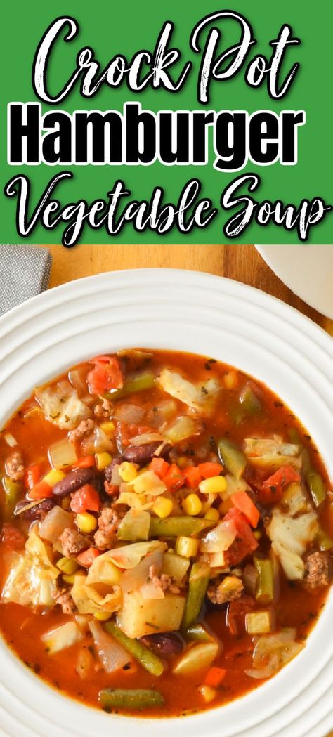 A down shot of a bowl of Crock Pot Hamburger Vegetable Soup. There is a green banner at the top with white text with black outline Crock Pot, below that black letters with white outline Hamburger, and below that white letters with black outline Vegetable Soup. Slow Cook Hamburger Soup, Hamburger Vegetable Soup With Cabbage, Hamburger Soup In Crockpot, Beef Vegetable Soup Crock Pot Easy, Crockpot Vegetable Soup With Hamburger, Hamberburger Soup, Easy Vegetable Soup With Ground Beef, Hamburg Vegetable Soup, Hamburger Soup Recipe Crockpot