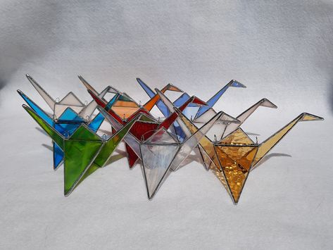 Restock just happened! A Stained Glass Origami Crane brings peace, good fortune and get well wishes. The 3D hanging bird can sit on a window ledge or bookcase. https://www.graphixglass.com #birthday #tabletop #stainedglass #stainedglassart #graphixglass Window Ledge, Get Well Wishes, Making Stained Glass, 3d Origami, Stained Glass Suncatchers, Origami Crane, Good Fortune, Copper Foil, Tiffany Style