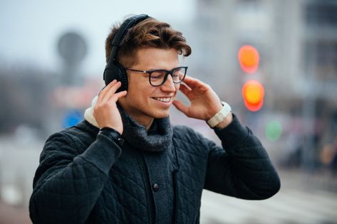 Glad attractive man listening to music in headphones, enjoying, walking on the street. Free Photo Listening To Headphones, Man Listening To Music, Topic Ideas, Male Profile, Crushing On Someone, Music Headphones, Video Advertising, Character Ideas, Warm Jacket