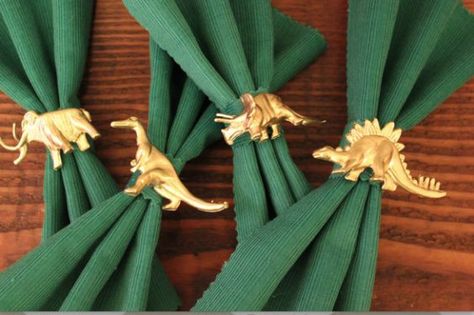 Did napkin holders go out of style? Bring them back with some metallic dinosaurs! Dinosaur Wedding Theme, Jurassic Wedding, Dinosaur Wedding, Plastic Dinosaurs, Dinosaur Birthday Party Decorations, בר מצווה, Napkin Holders, Dinosaur Theme, Wedding 2024