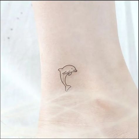 Dolphin Tattoo On Ankle, Tiny Dolphin Tattoo, Delfino Tattoo, Dolphin Tattoos, Dolphin Tattoo, Dolphins Tattoo, Cute Simple Tattoos, Ankle Tattoo Small, Small Pretty Tattoos