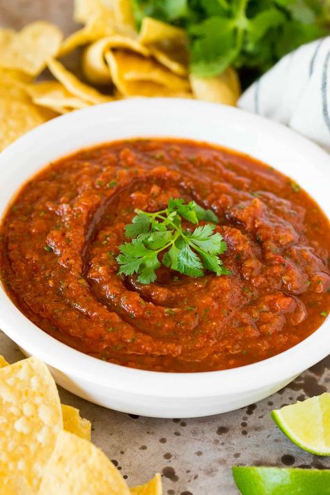 This chipotle salsa is a blend of fire roasted tomatoes, onion, chipotle peppers, cilantro and lime juice, all mixed together to make a smoky and spicy salsa. A quick and easy appetizer option that takes just minutes to prepare and always gets rave reviews! Roasted Chipotle Salsa, Chipotle Red Salsa, Chipotle Tomato Salsa Recipe, Chipotle Roasted Corn Salsa Recipe, Chipotle Tomatillo Salsa Recipe, Chipotle Salsa Recipe, Roasted Green Chili, Red Salsa, Mild Salsa