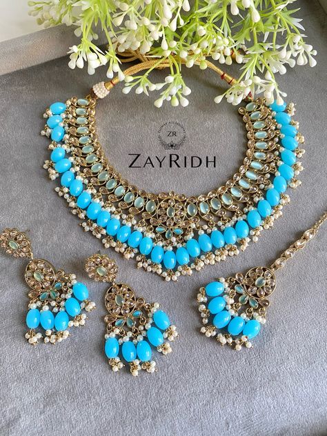 Dive into the world of elegance with this turquoise-blue gold plated necklace set. The vibrant colour with gold plating looks stunning. Compliment your matching outfit with this turquoise-blue gold plated necklace set. About this Turquoise Blue Gold Plated Necklace Set - Premium material never fade away - The turquoise colour is full of energy and enhance your look - Best to pair with ethnic attire - Perfect for formal wedding event Gold Indian Necklace, Bridal Tikka, Asian Necklace, Indian Artificial Jewellery, Indian Necklace Set, Golden Plate, Turquoise Colour, Kundan Jewellery Set, Earrings Necklace Set