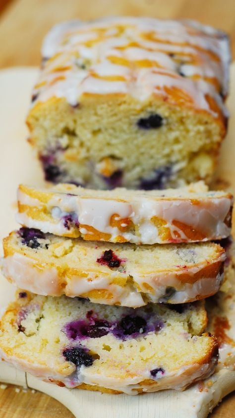 Blueberry vanilla bread with lemon glaze. This delicious bread is stuffed with blueberries, and deliciously flavored with vanilla and lemon zest. Moist Lemon Blueberry Bread, Blueberry Lemon Loaf Recipe, Lemon Blueberry Loaf With Lemon Glaze, Blueberry And Lemon Loaf, Blueberry Loaf Bread, Blueberry Lemon Loaf, Lemon Bread Recipe, Blueberry Lemon Bread, Lemons Recipes