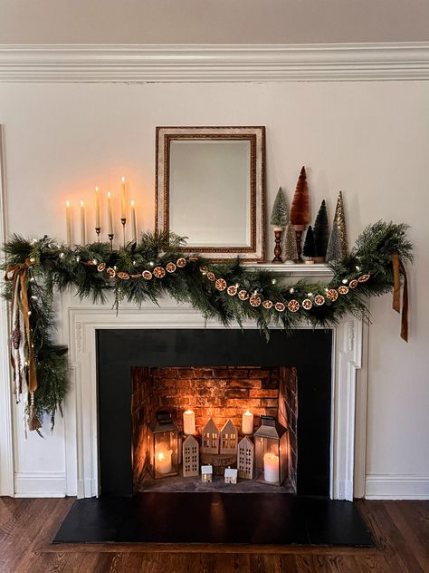 Lush and Rust Christmas Mantel - Nest of Posies Christmas Mantels Red And Green, Wreath On Fireplace Mantel, Christmas Lights In Fireplace, Non Fireplace Mantle Ideas, Vintage Christmas Fireplace Mantle, Christmas Decorations Entertainment Center, One Sided Garland Mantle, Dried Orange Garland Mantle, Chic Christmas Mantle Decor