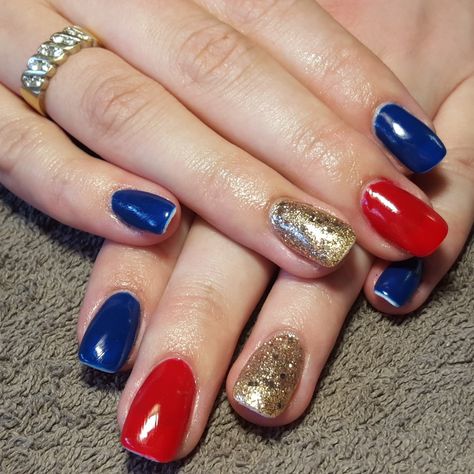 nails, accent nail, gelish, shellac, gellac, nail art, superman, blue, red, gold, glitter, super girl Red Blue And Silver Nails, Red Blue And Gold Nails, One Hand Red One Hand Blue Nails, Red Blue Gold Nails, Nails Accent Nail, Superman Nails, Nail Gelish, Blue Gold Nails, Superman Blue